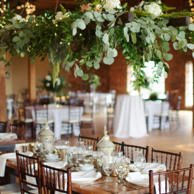 wedding reception space with overhead florals